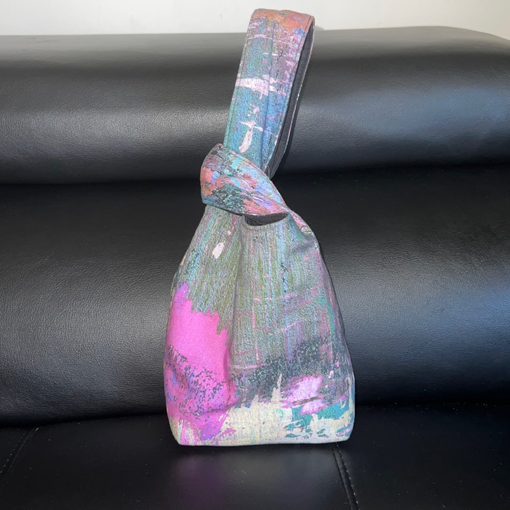 Brand new worn once for honeymoon. High demand bag by designer Carlton Yaito.